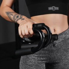 Woman holding Body Wisdom Push-Up Bars